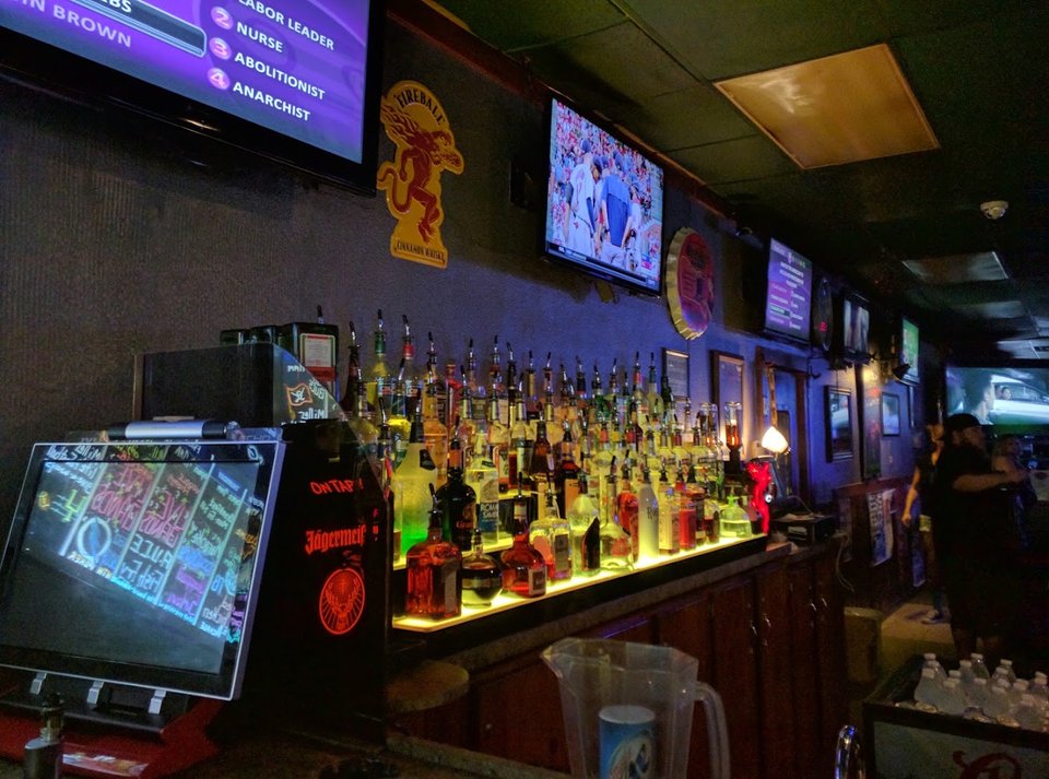 Bar stools, tables, and a laid-back dining room.